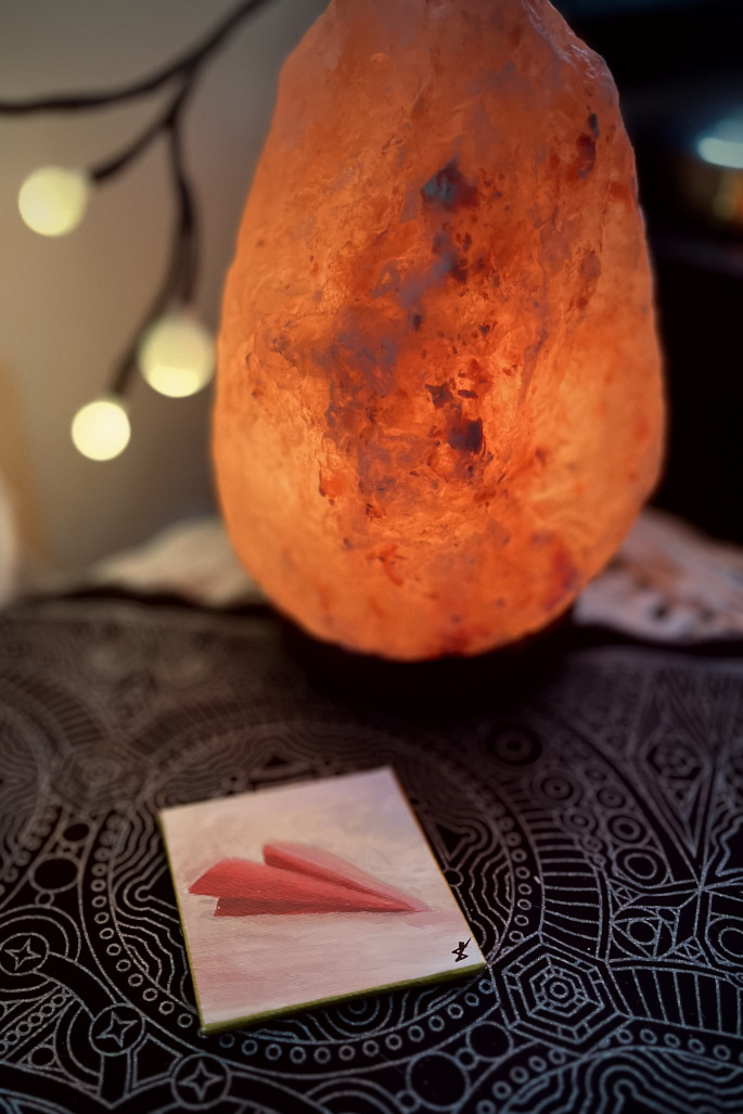 A red letter landing beside the hearth.